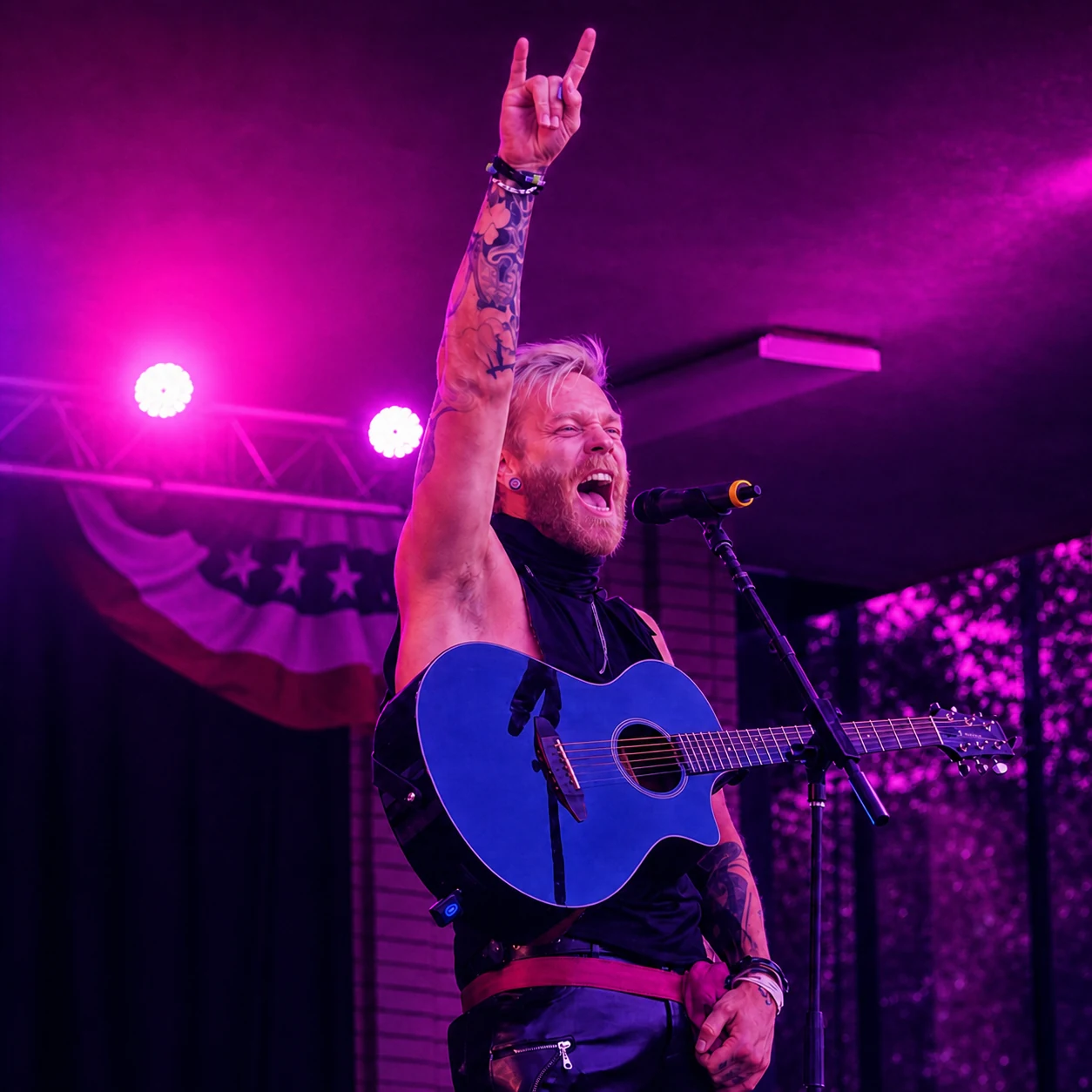 Seth Bonnell performing live with a blue acoustic guitar