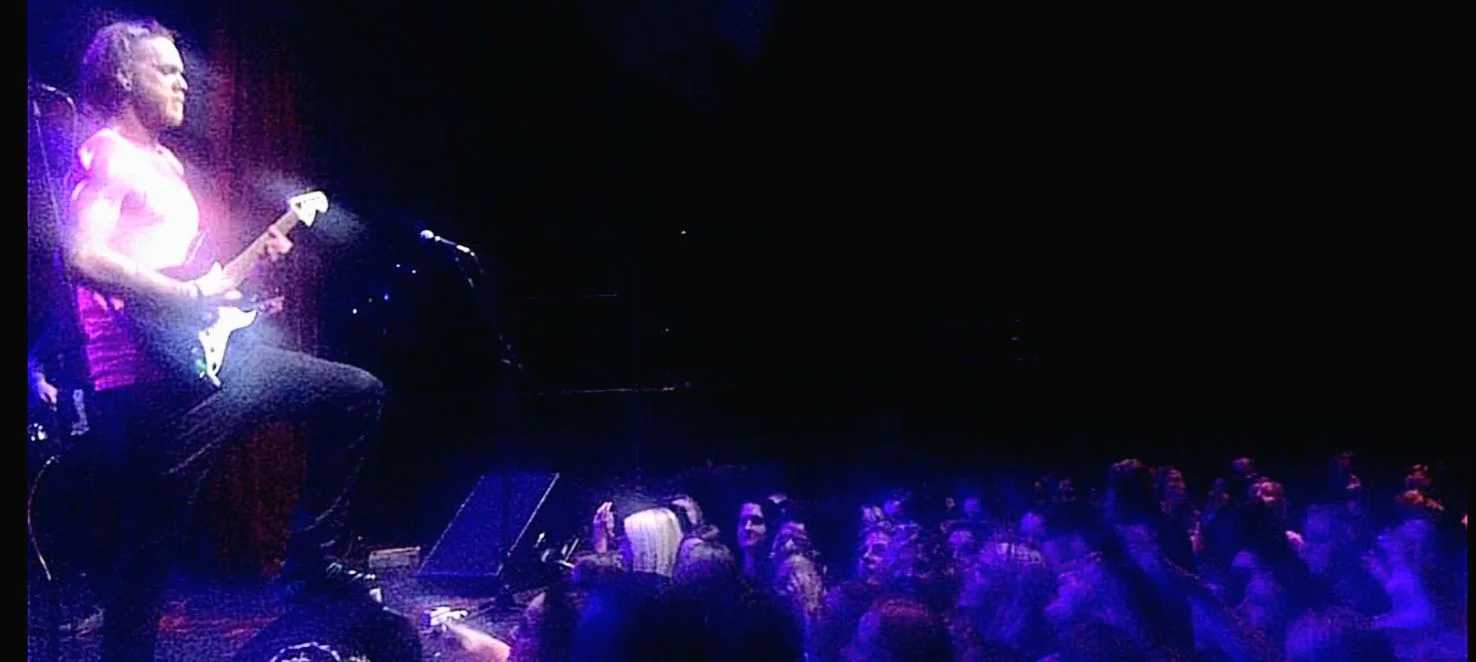 Seth Bonnell on stage at a Utah venue